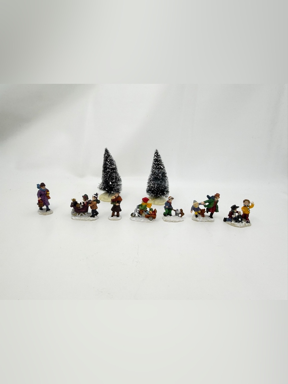 Lot of 7 Figurines And 2 Lemax Trees Christmas Village Figures Miniature